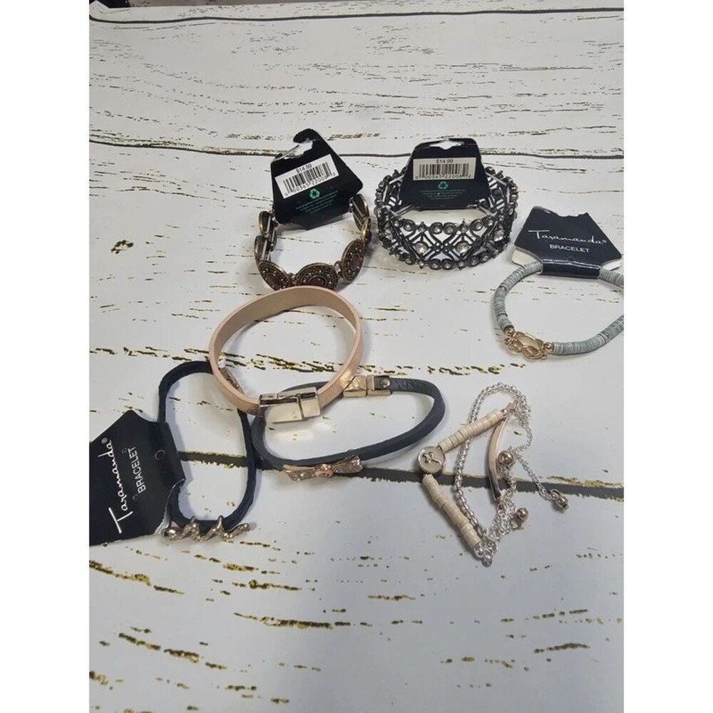 7 Bracelets , all included.